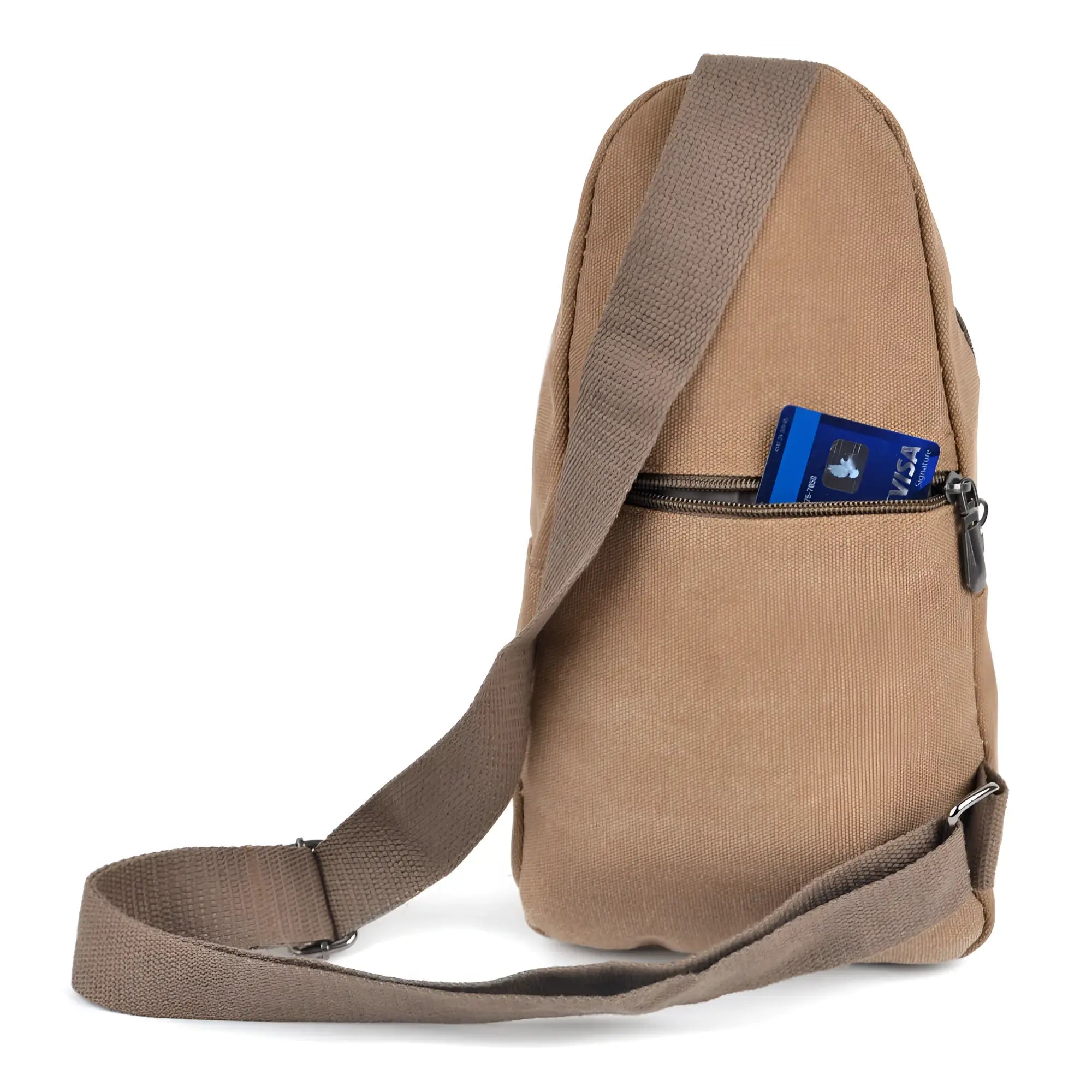 Tan canvas sling bag with adjustable shoulder strap and front zippered pocket holding a blue visa card