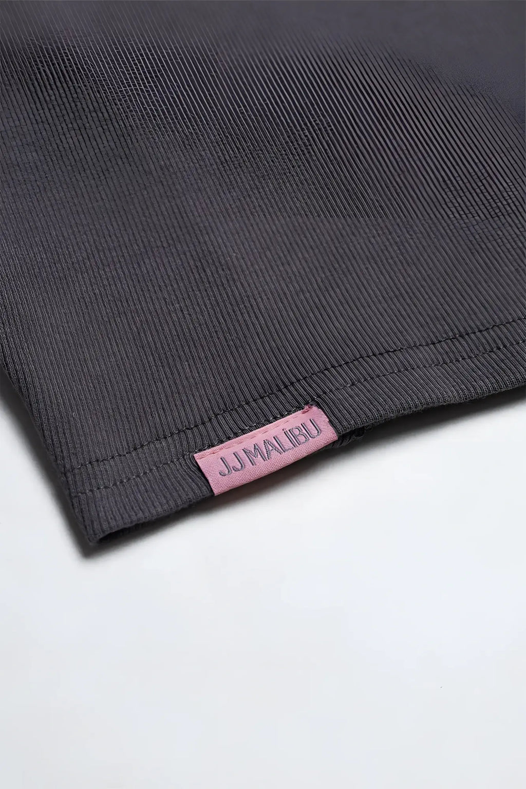 Dark gray ribbed knit cap sleeve crop top with pink jj malibu label in storm grey color