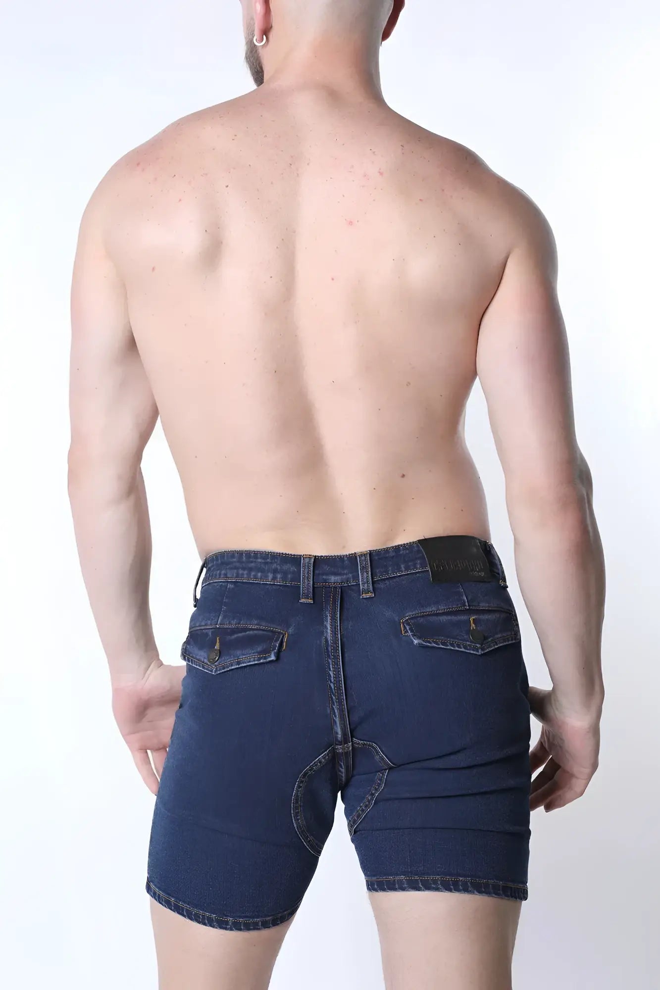 Dark blue full court denim zipper shorts with five-pocket design and black leather patch on back waistband