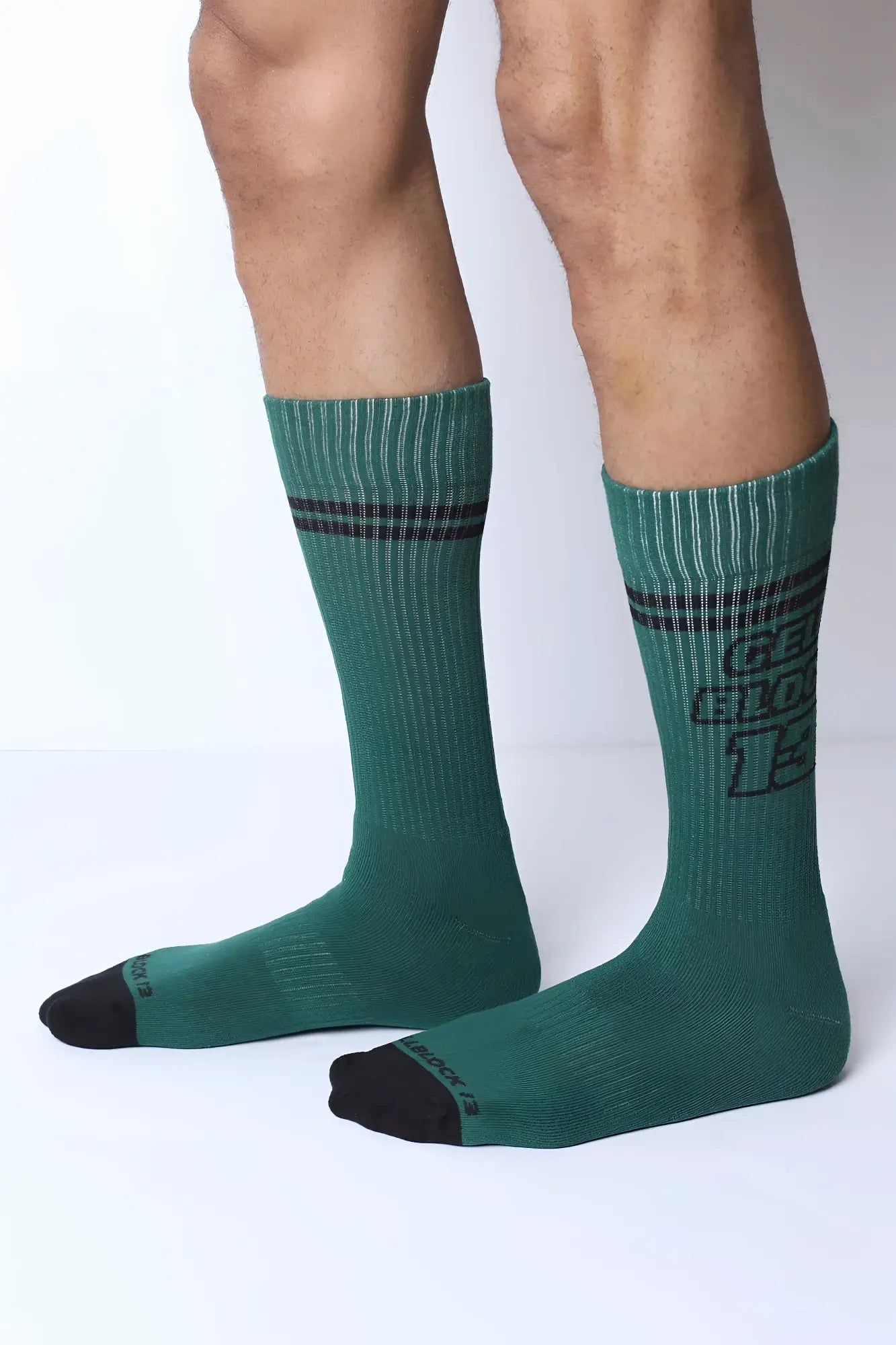 Dark green starter crew socks with black stripes bold graphic print and reinforced toe caps for durable wear
