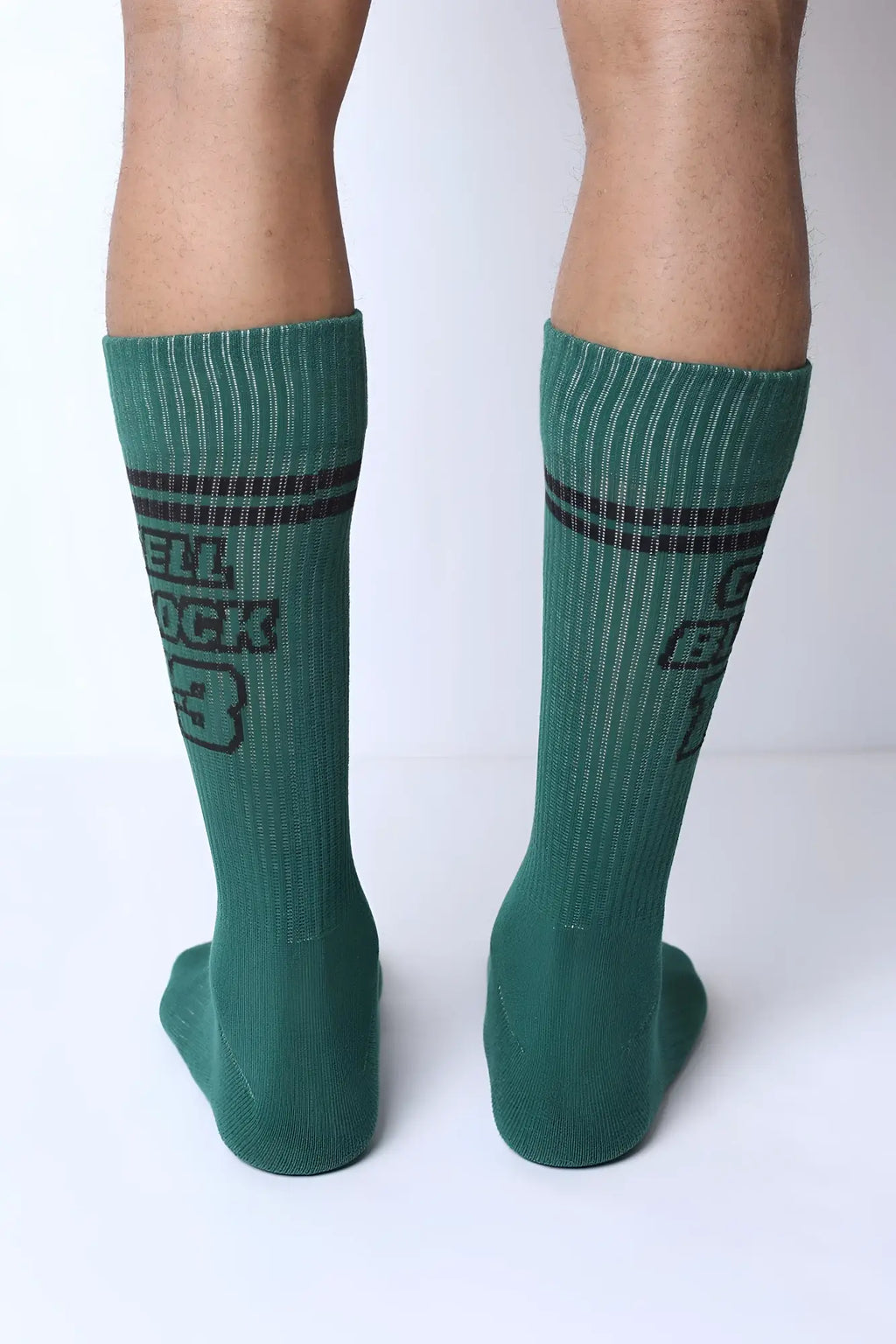 Starter crew socks in green ribbed cotton with dark gray stripes and a bold cell rock 3 graphic on the side