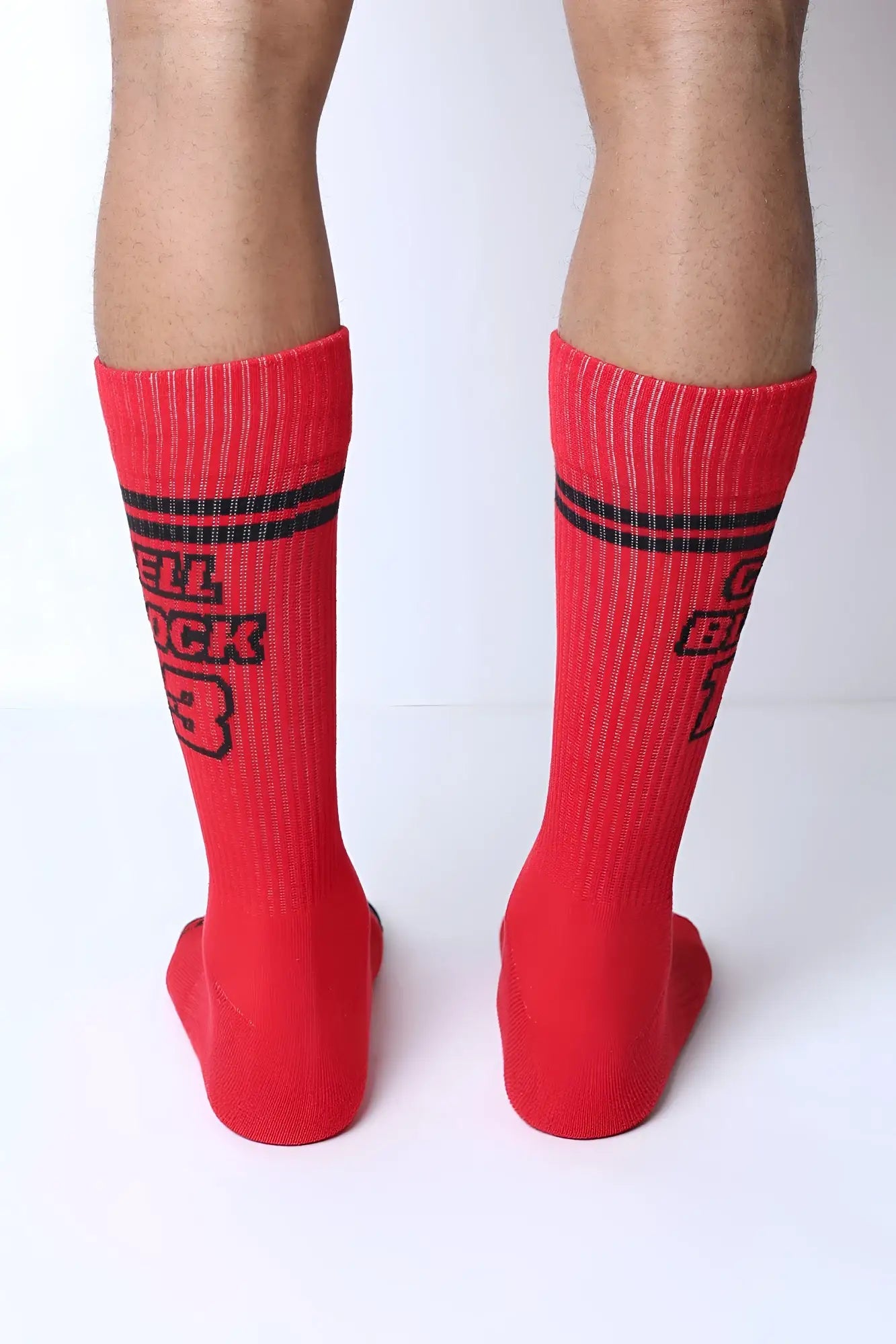 Starter crew socks featuring red crew socks with black horizontal stripes and hell buck 3 text in bold lettering