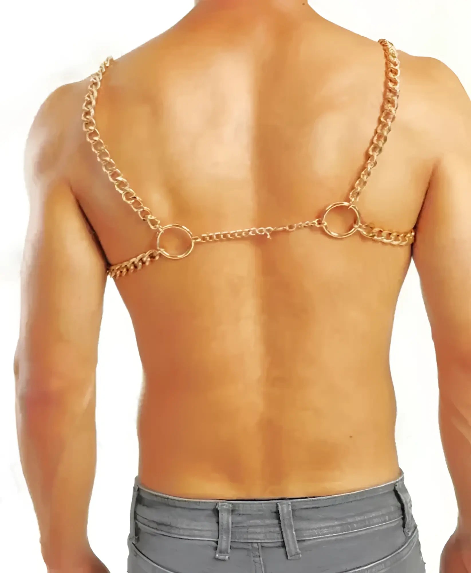 Gold-colored chain harness with two large circular rings and central link worn across the back side of the body