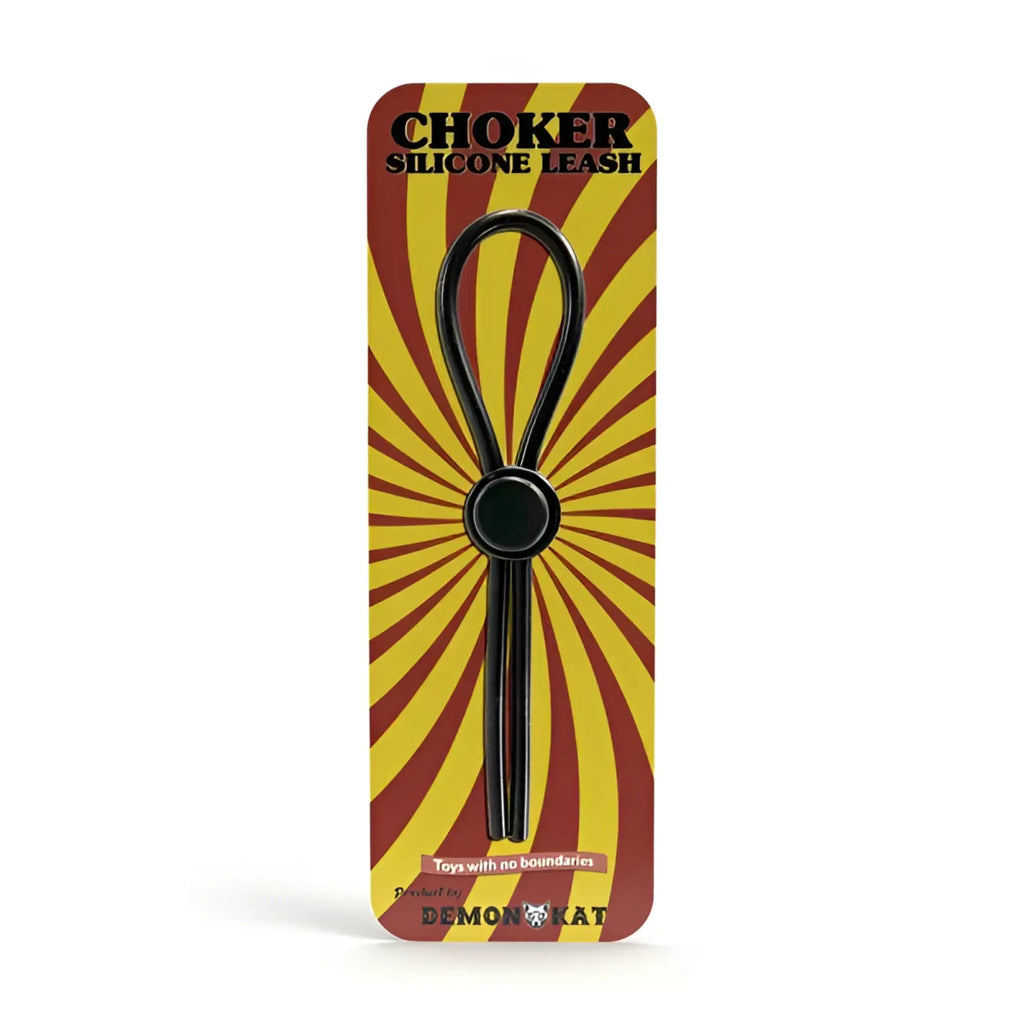 Black silicone choker leash with central circular ring packaged in red and yellow sunburst design