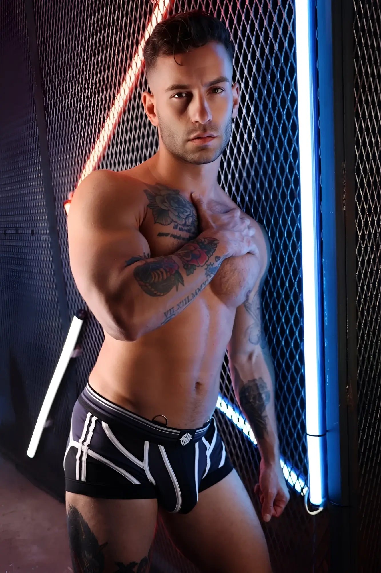 Black circuit breaker boxer brief with bold white geometric stripes and subtle logo on waistband in athletic fabric