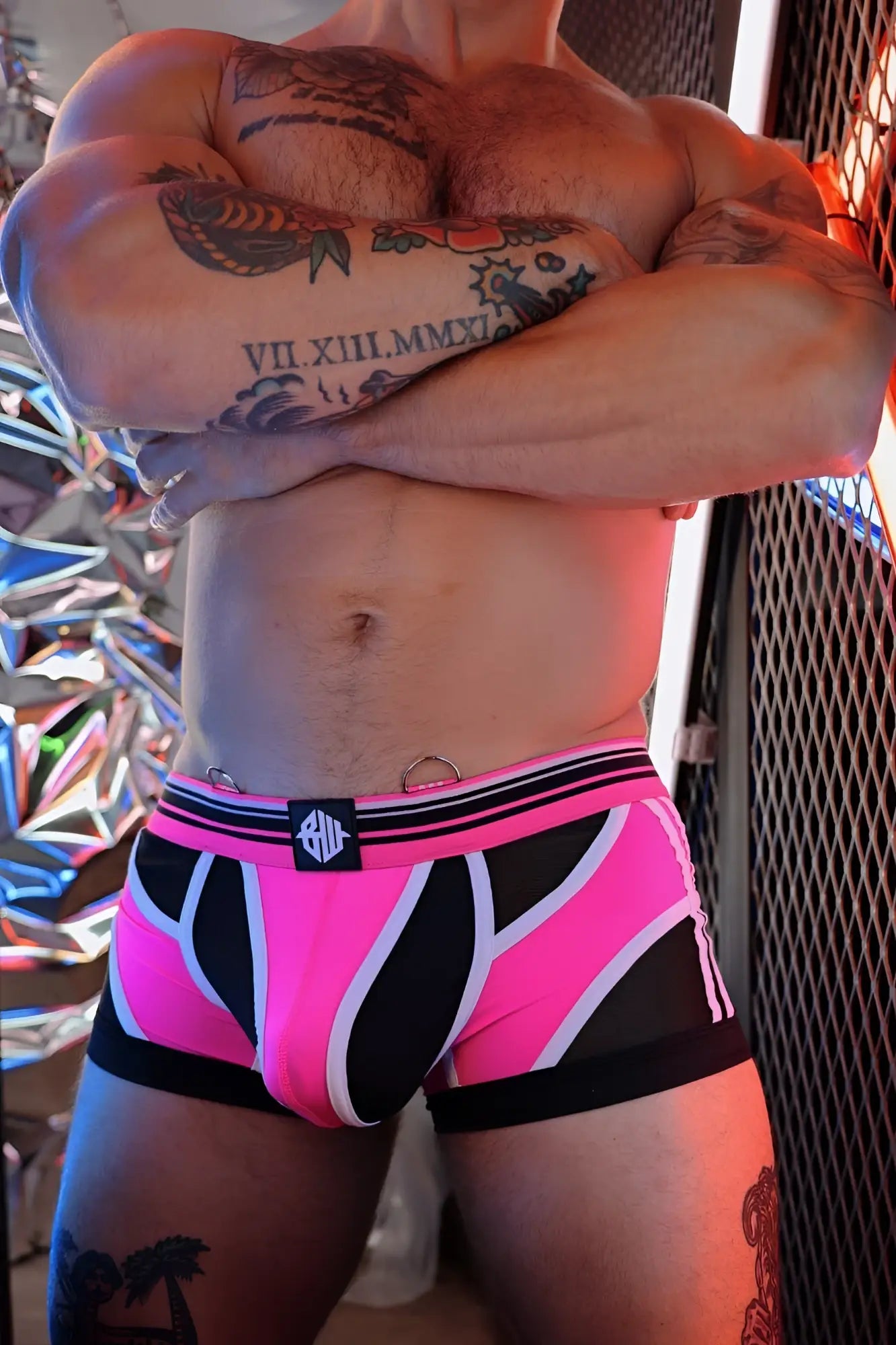 Circuit breaker boxer brief in vibrant pink and black patterned fabric with white accents and branded waistband