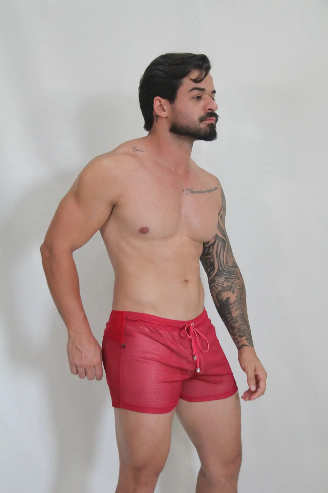 Red mesh swim trunks with white drawstring ties circuit mesh short in red featuring breathable fabric and secure fit