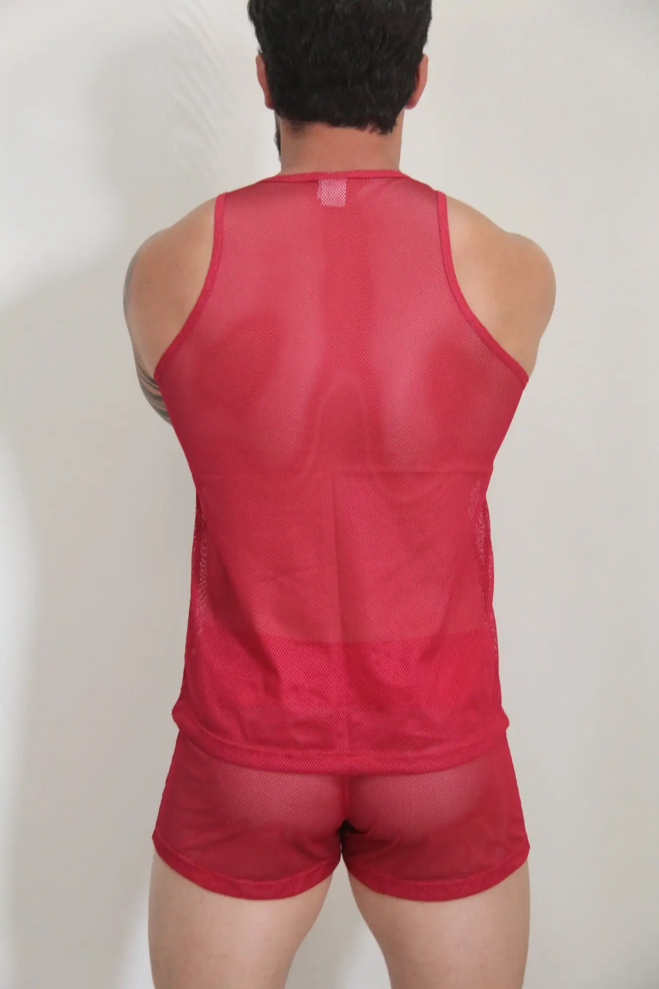 Red mesh tank top and matching shorts set made of breathable circuit mesh fabric available in four colors