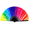 A vibrant rainbow-colored folding fan with a sparkling star pattern and black ribbed handle from Clack Fans