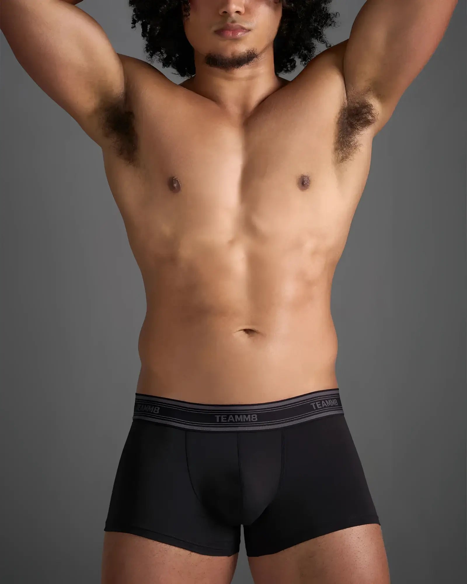 Black classic cotton trunk boxer briefs with gray elastic waistband and white brand lettering