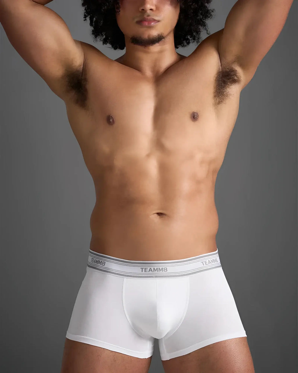 White classic cotton trunk boxer briefs with gray elastic waistband featuring black brand lettering