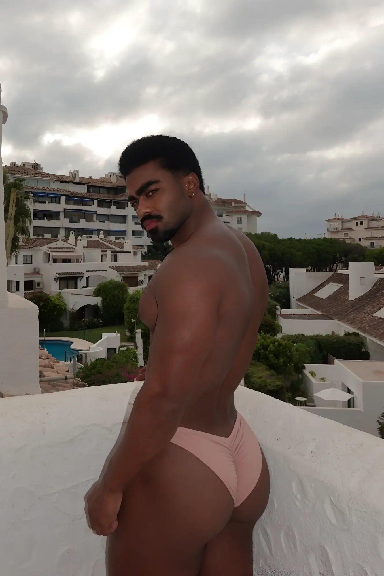 Pink athletic swim briefs with a gathered back design from classic scrunch-butt swim briefs nude pink collection