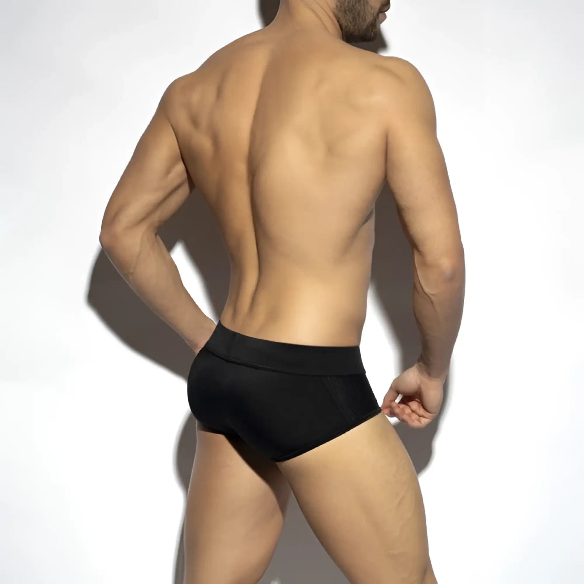 Black classic swim brief with textured mesh-like pattern on the sides for comfortable athletic use