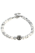 Classy wrinkle bracelet featuring white and black marbled beads with a silver-toned b charm