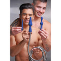 Two shirtless men smiling while holding a CleanStream 3pc blue silicone enema attachment set with a metal hose.