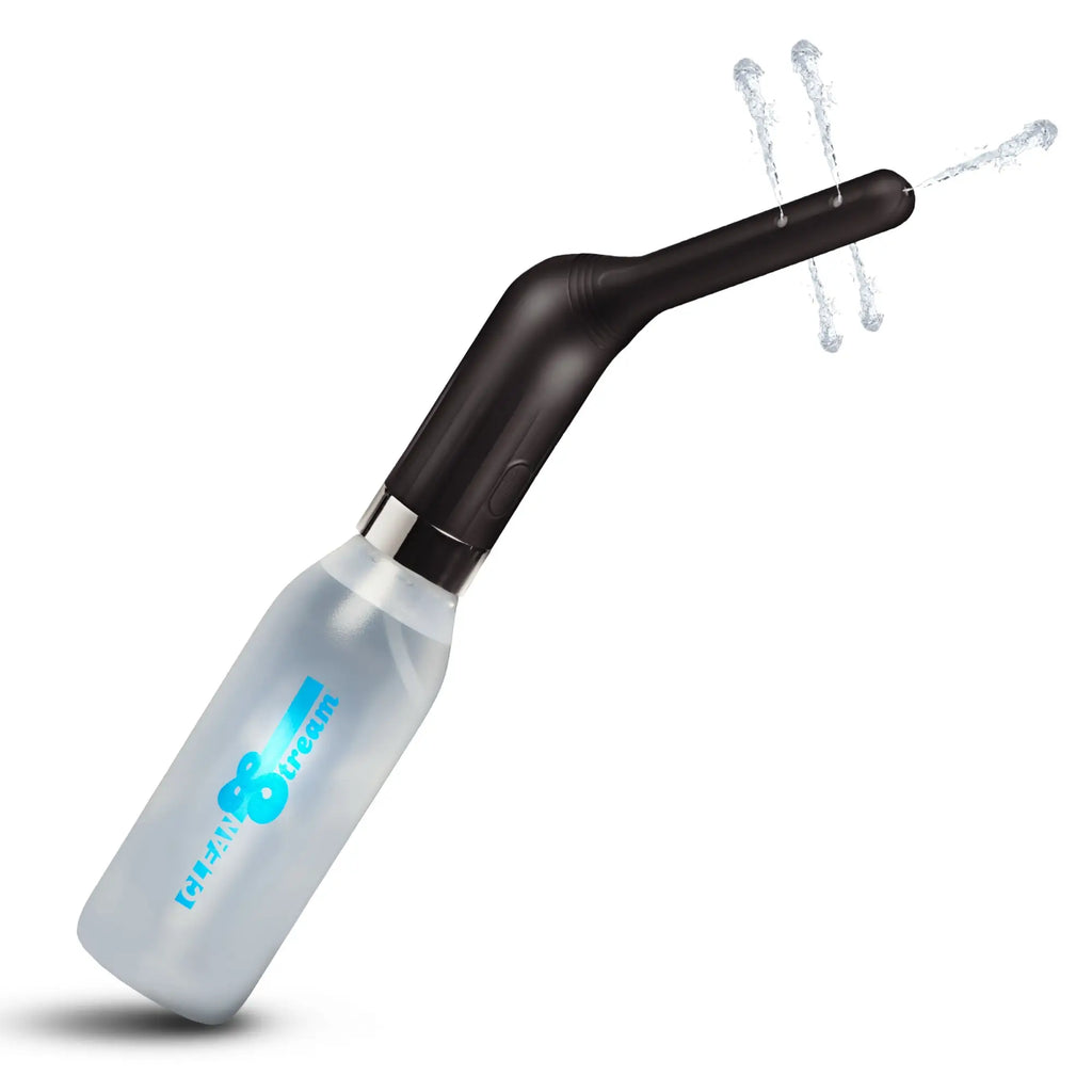 CleanStream Automatic Enema Set with a translucent bottle and a black, angled nozzle spraying three streams of water.