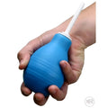 A hand holding a blue CleanStream enema bulb with a white nozzle against a white background.