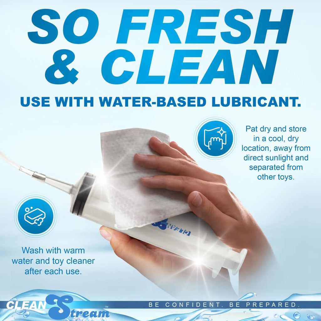 Hands wiping a white 150 mL CleanStream enema syringe with a cloth, featuring instructions for cleaning and storage.