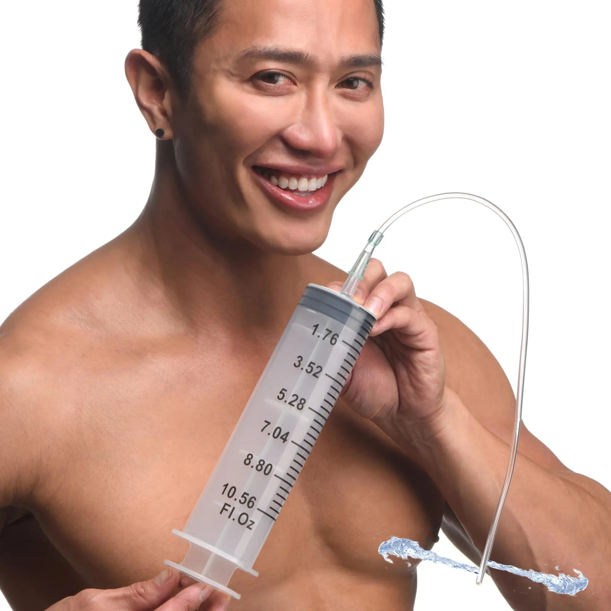 A smiling man holds a large, translucent CleanStream enema syringe with graduated markings and a flexible tube.