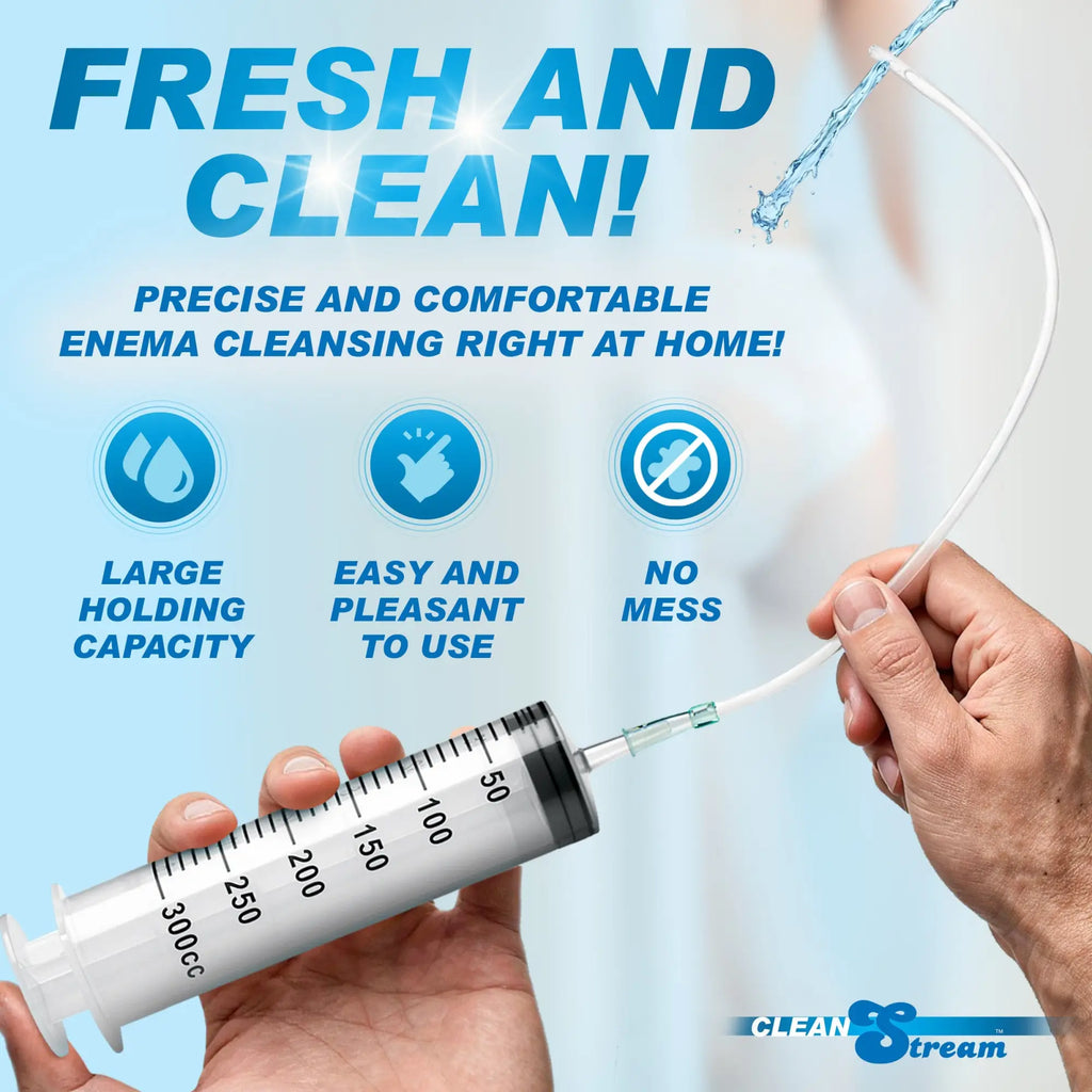 CleanStream Enema Syringe with tube, showing a large 300cc clear plastic syringe held by hands, spraying water.
