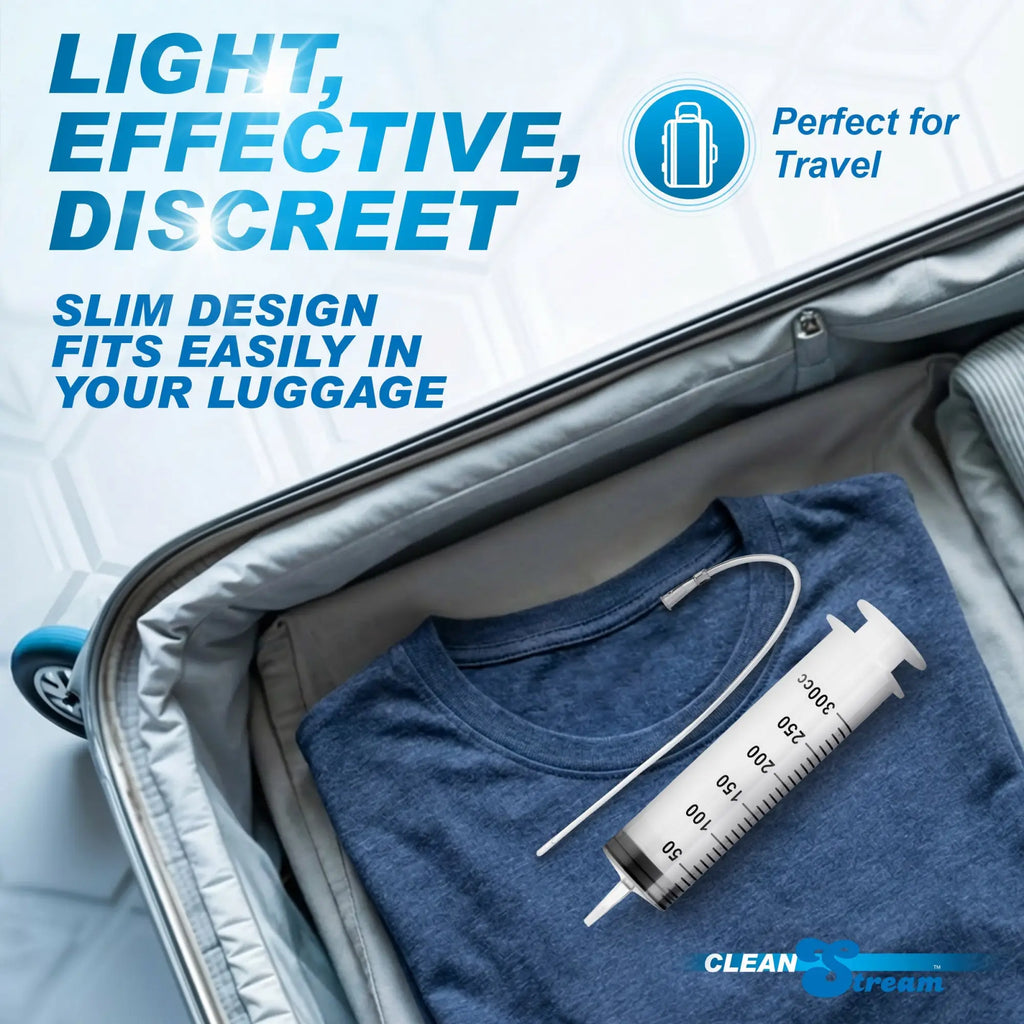 CleanStream enema syringe with tube packed inside a suitcase with folded clothing, promoting travel-ready portability.