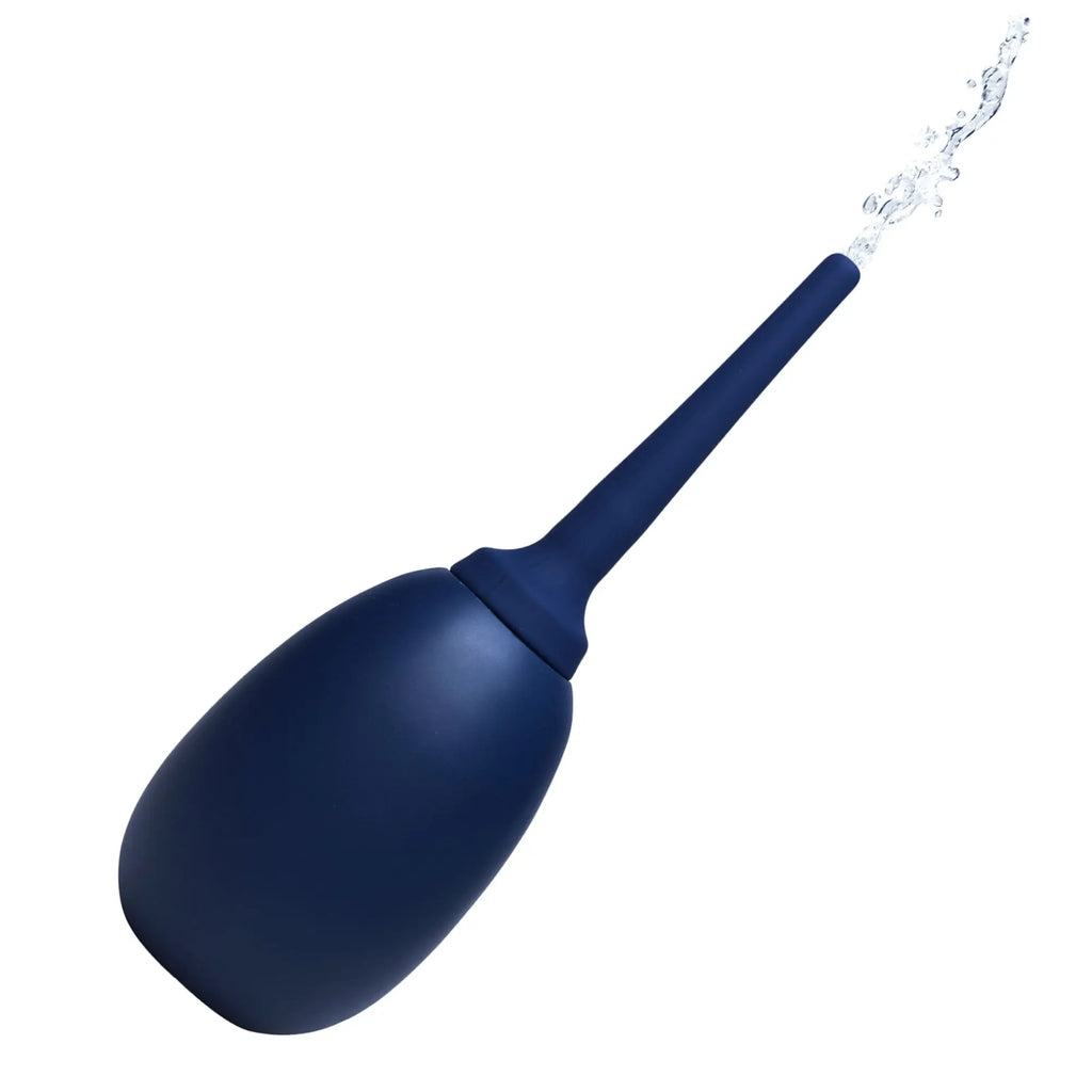 CleanStream Flex Tip Enema Bulb: A dark blue silicone squeeze bulb with a long, flexible nozzle spraying water.