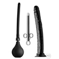 CleanStream Go Deep kit: black bulb enema, metal applicator, and large black textured dildo with a suction base.