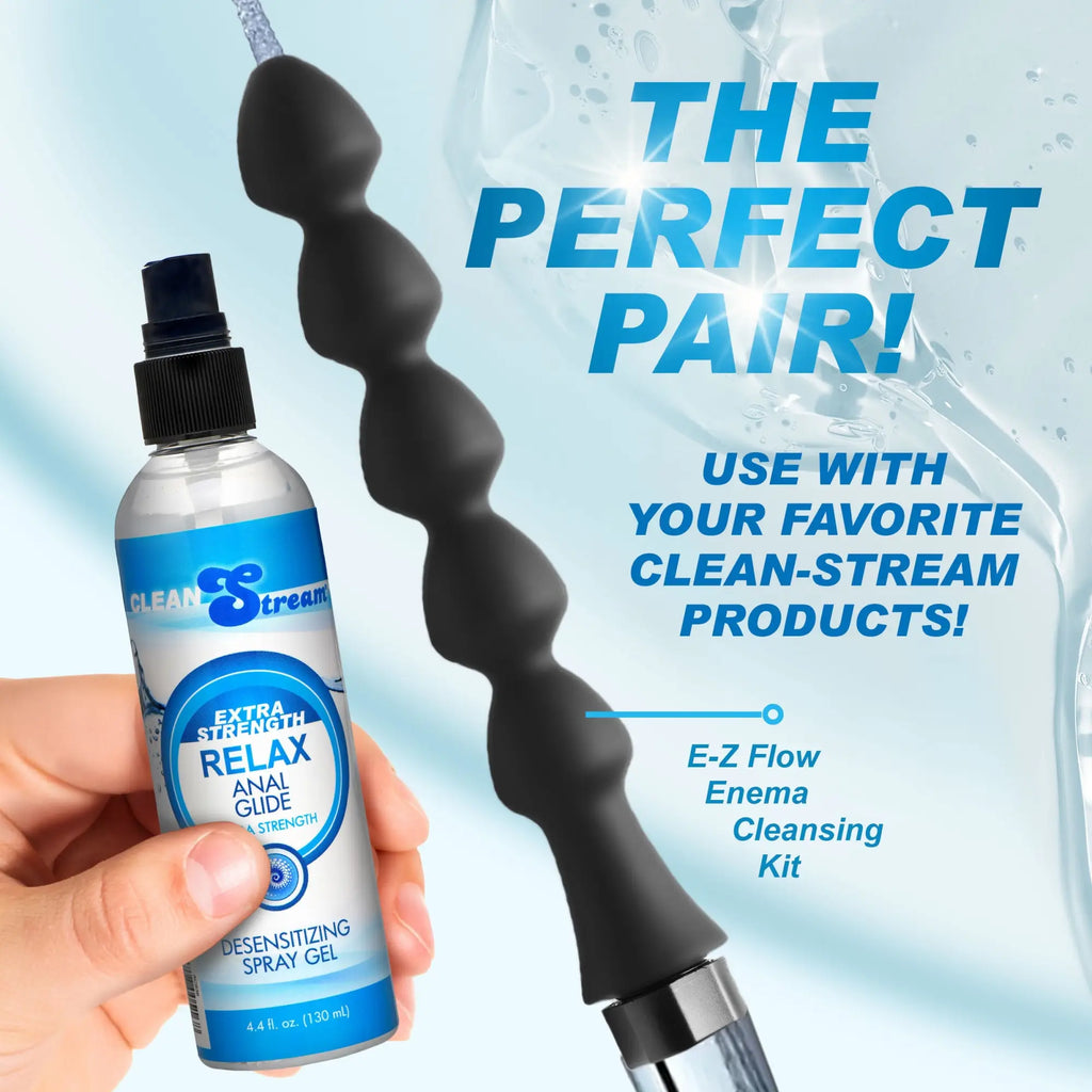 CleanStream Relax Anal Glide spray held next to a black, multi-beaded enema attachment on a light blue water background.
