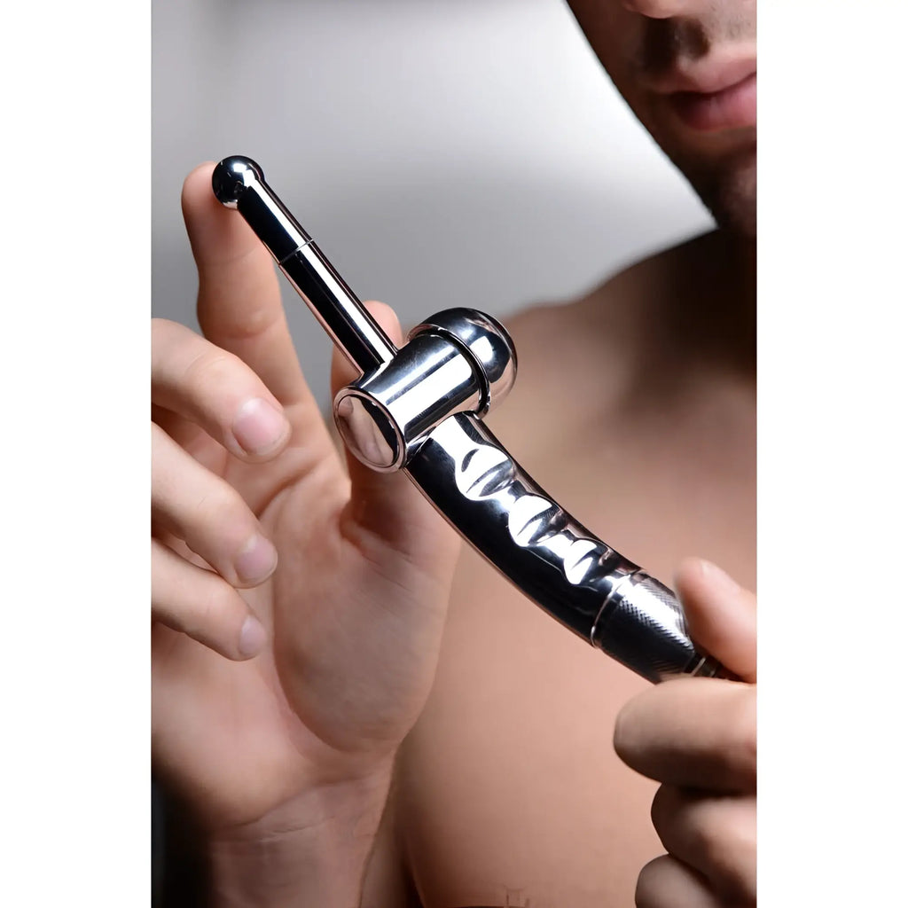 CleanStream Shower Cleansing Nozzle with chrome, metallic finish, held by a man to show its ergonomic, sleek design.