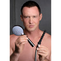 A man holds a chrome CleanStream shower head and a flexible black silicone attachment connected to a metal hose.