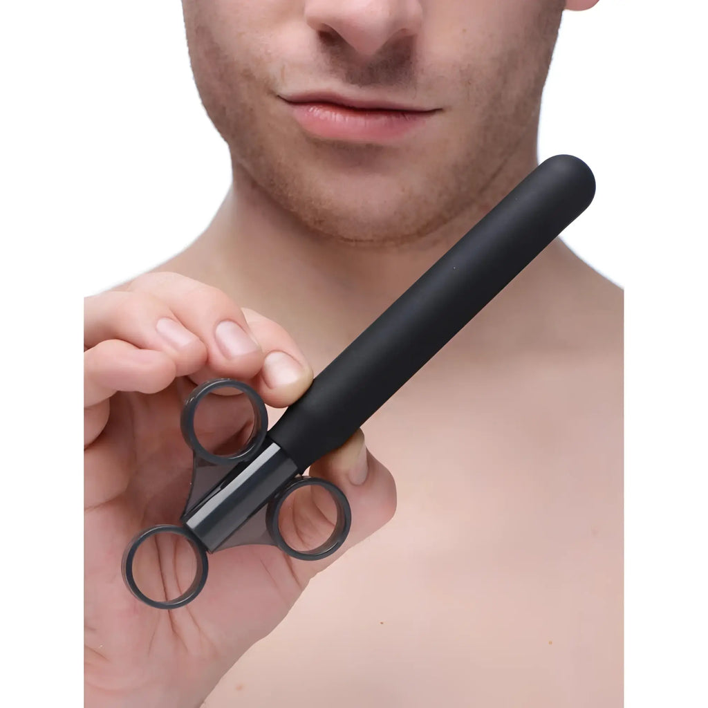 CleanStream Smooth Silicone Lubricant Launcher: a black, syringe-style applicator with a three-ring handle held by a man.