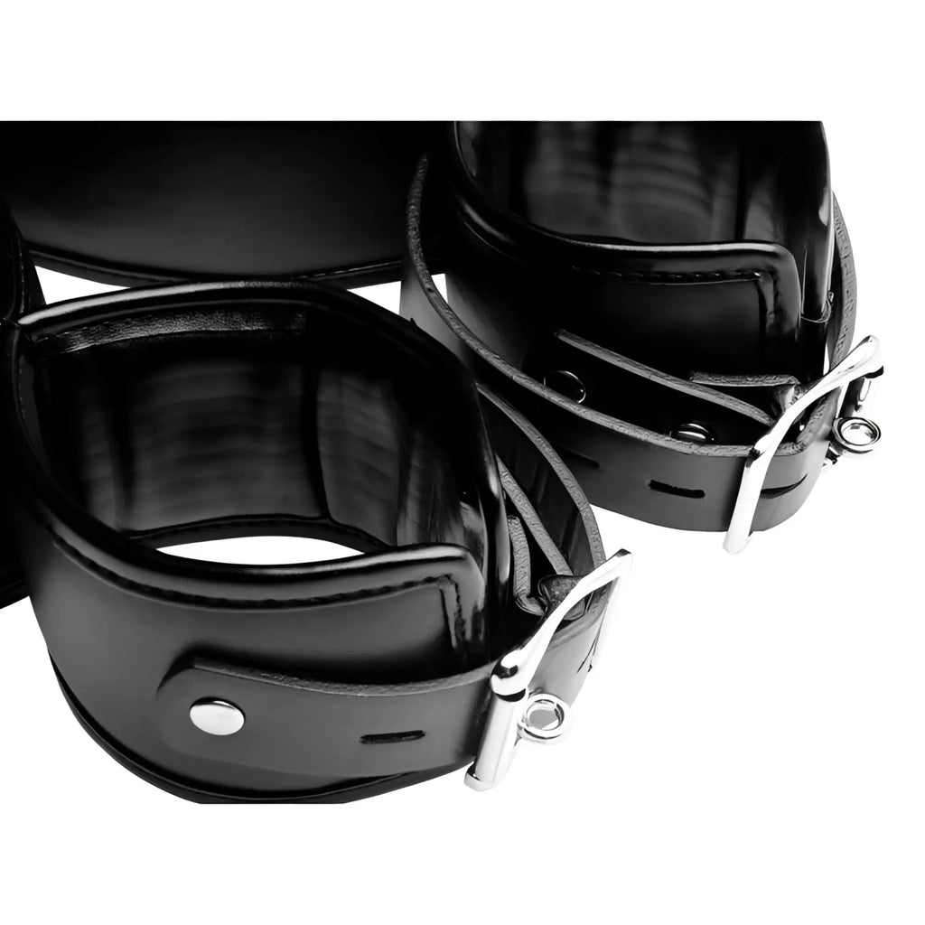 CleanStream Thigh Cuff Restraint System: two black faux leather thigh cuffs with adjustable silver-tone metal buckles.
