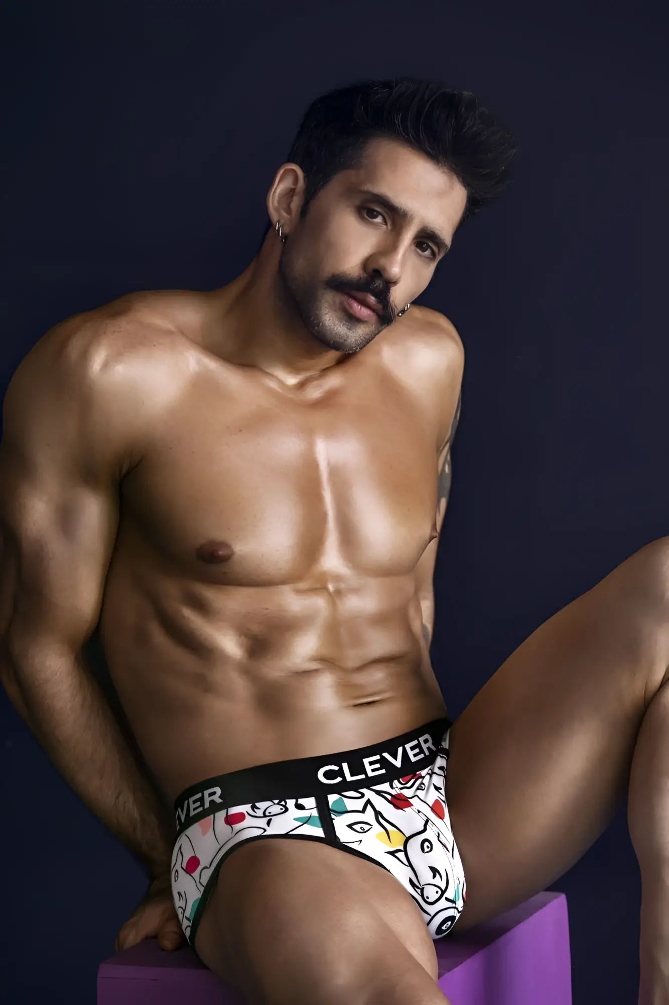 White clever 1726 grange briefs featuring a playful cartoon cat and dice pattern on a white fabric waistband visible