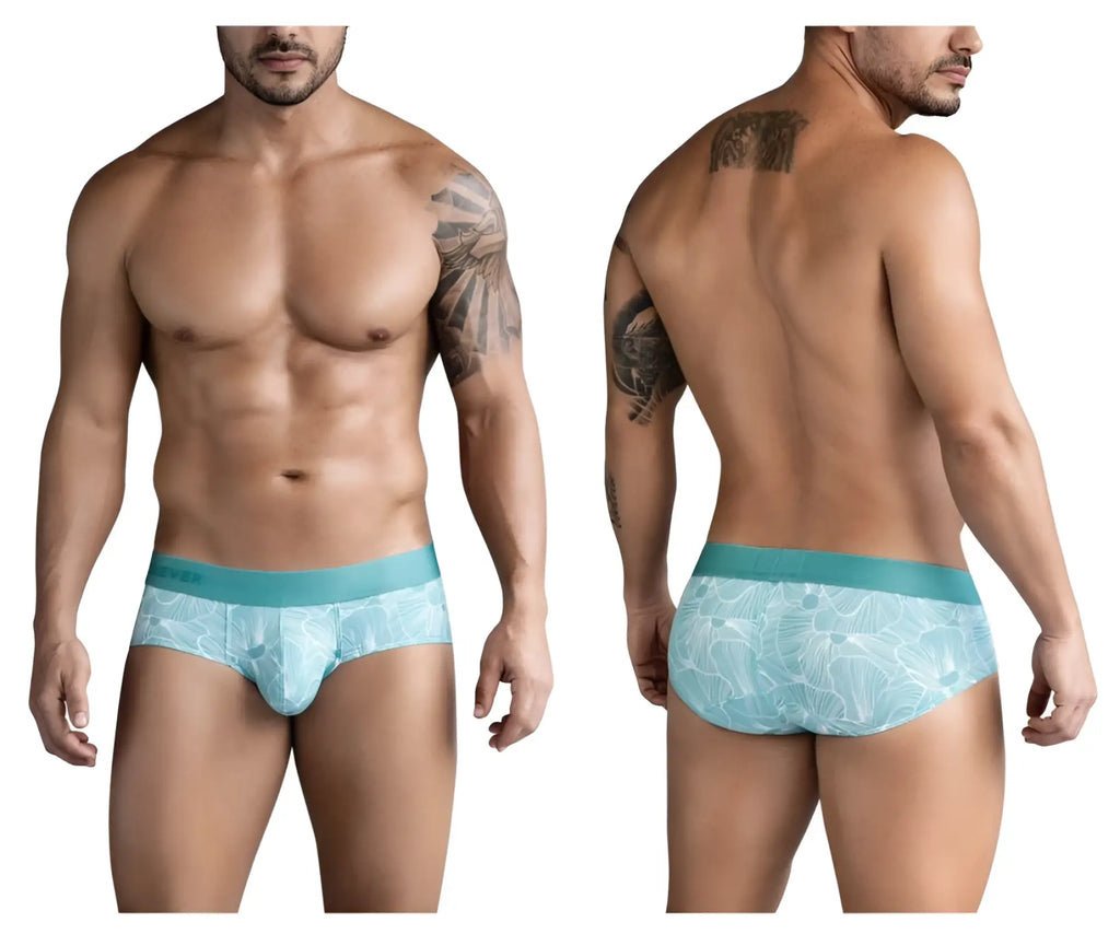 Light blue tropical leaf patterned clever 1730 rose briefs for men with a solid teal waistband in green color