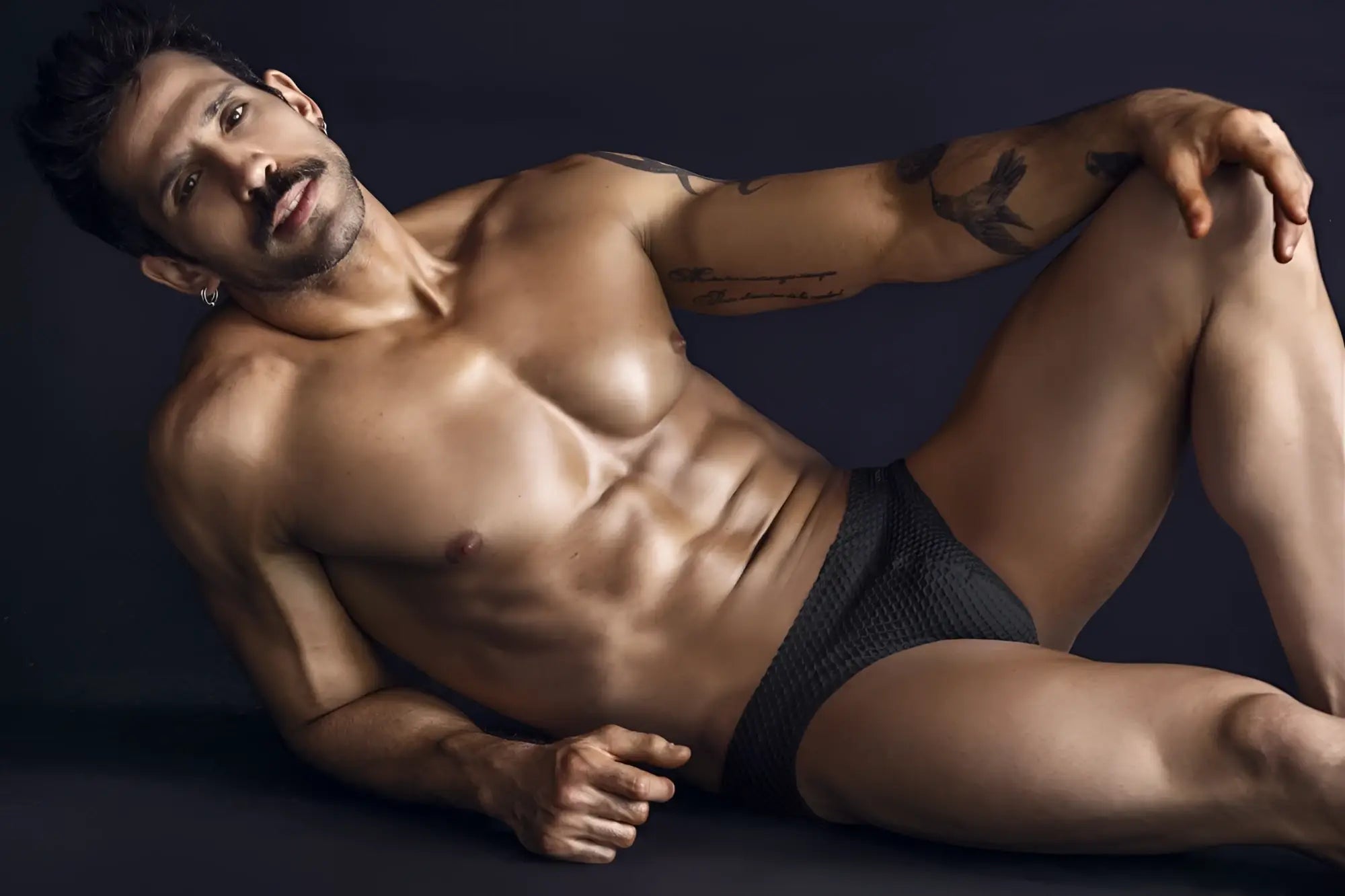 Black textured briefs clever 1743 island swim briefs in black shown from the front for swimwear use