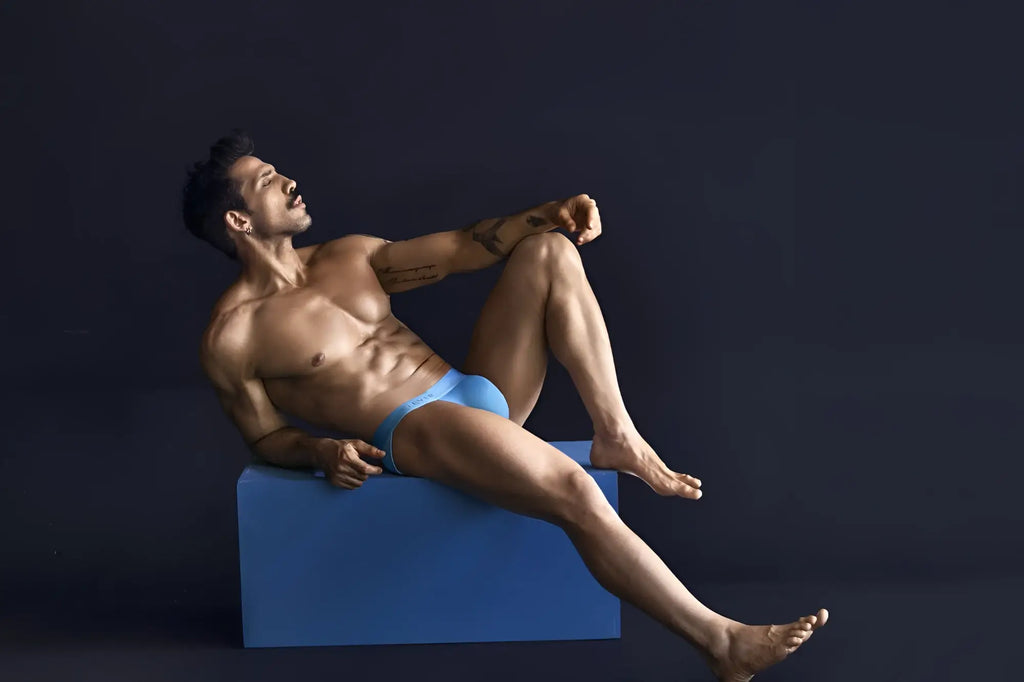 A man wearing bright blue eco-friendly Clever 1749 bikini briefs made from sustainable material front view