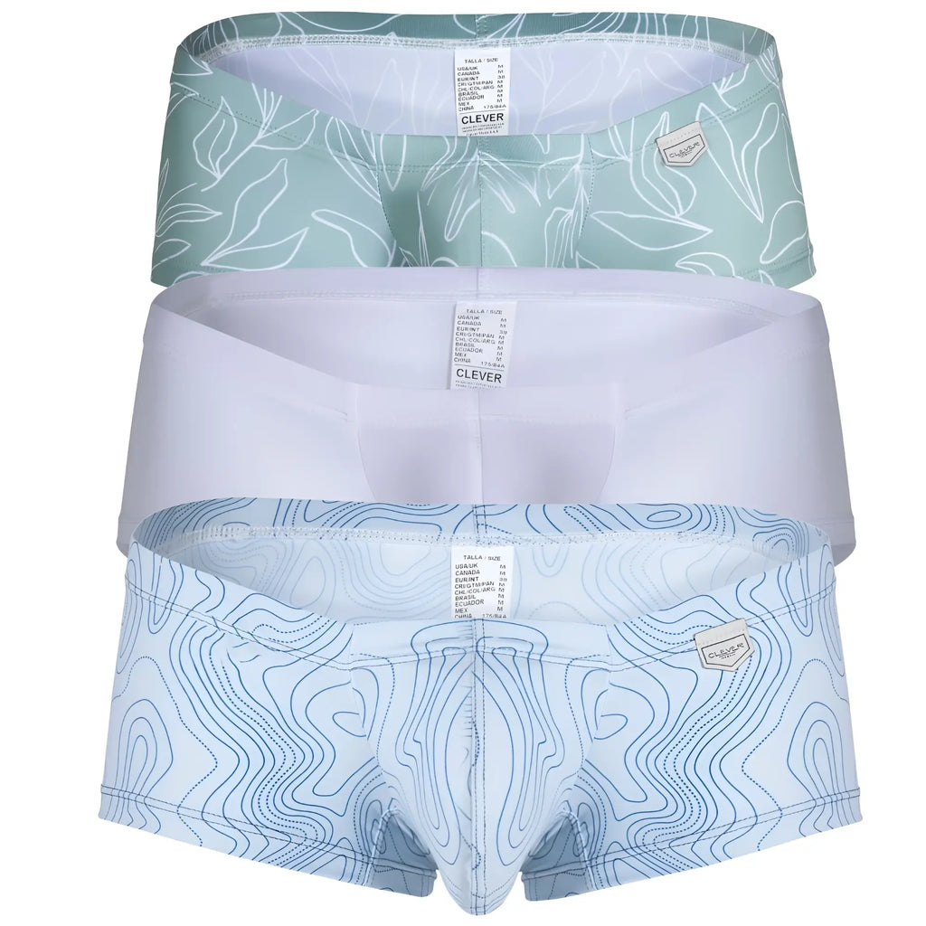Set of three clever Australian Latin trunks in mint green with white leaves, solid white, and blue topographic designs