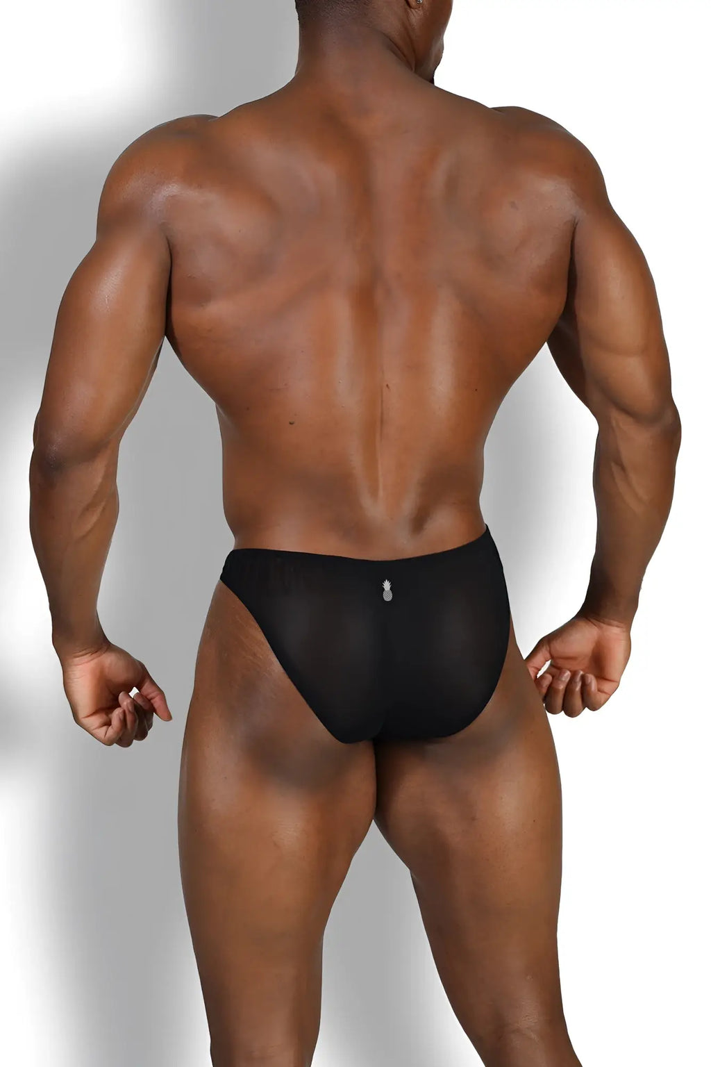 The back side of black sheer mesh club-kid mesh bikini briefs with a small white logo at the center back