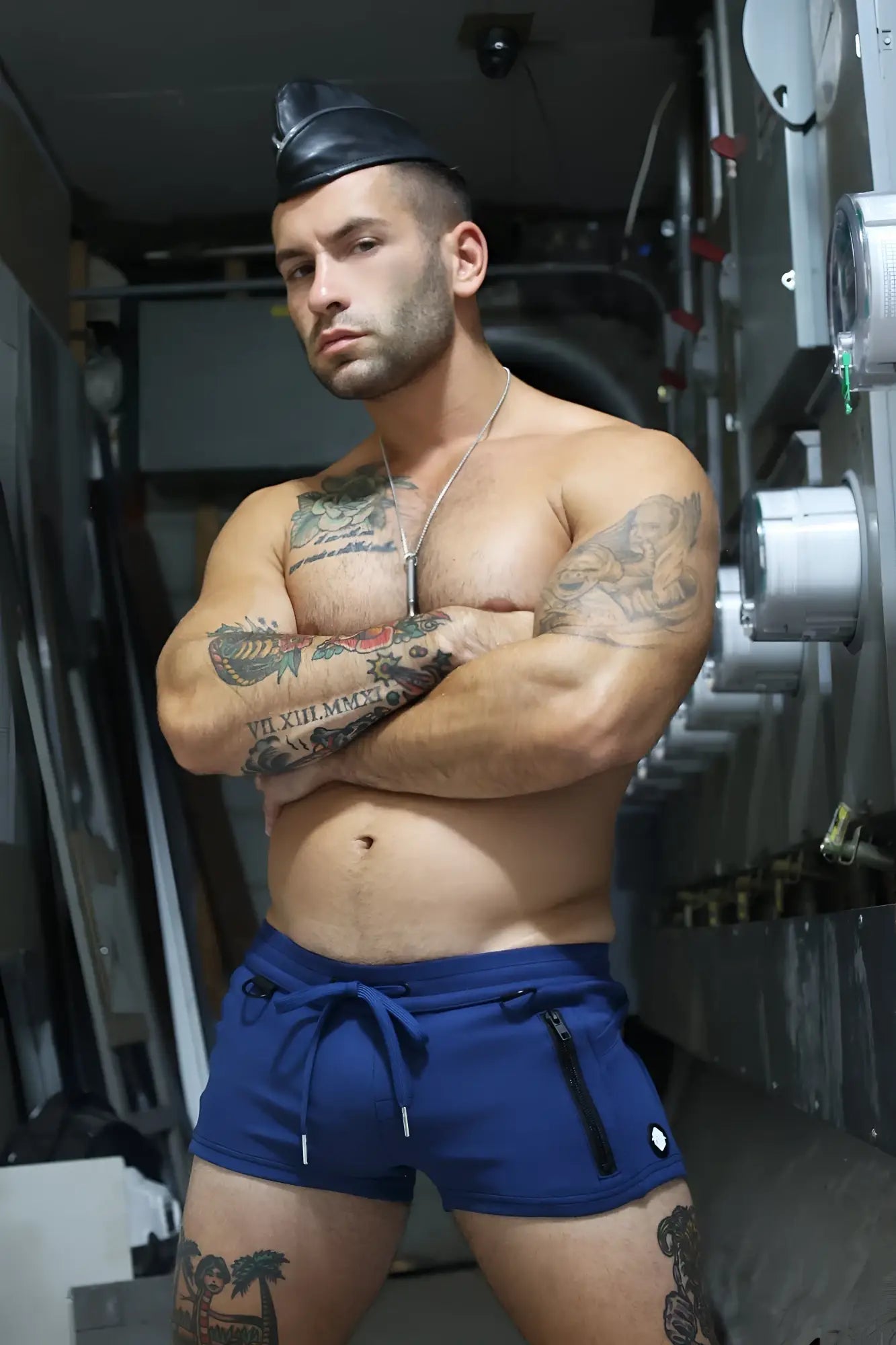 Blue cockpit shorts with drawstring waistband and black zipper detail designed for athletic use