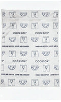 White mesh laundry bag with black boxer briefs pattern and cocksox branding featuring wash me softly love me longer slogan