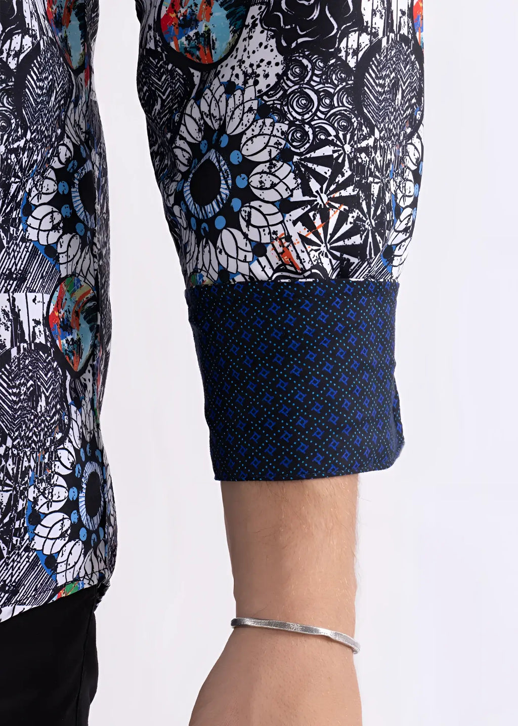 Colored shapes print long sleeve shirt with black white intricate pattern and blue orange accents on sleeve and navy cuff