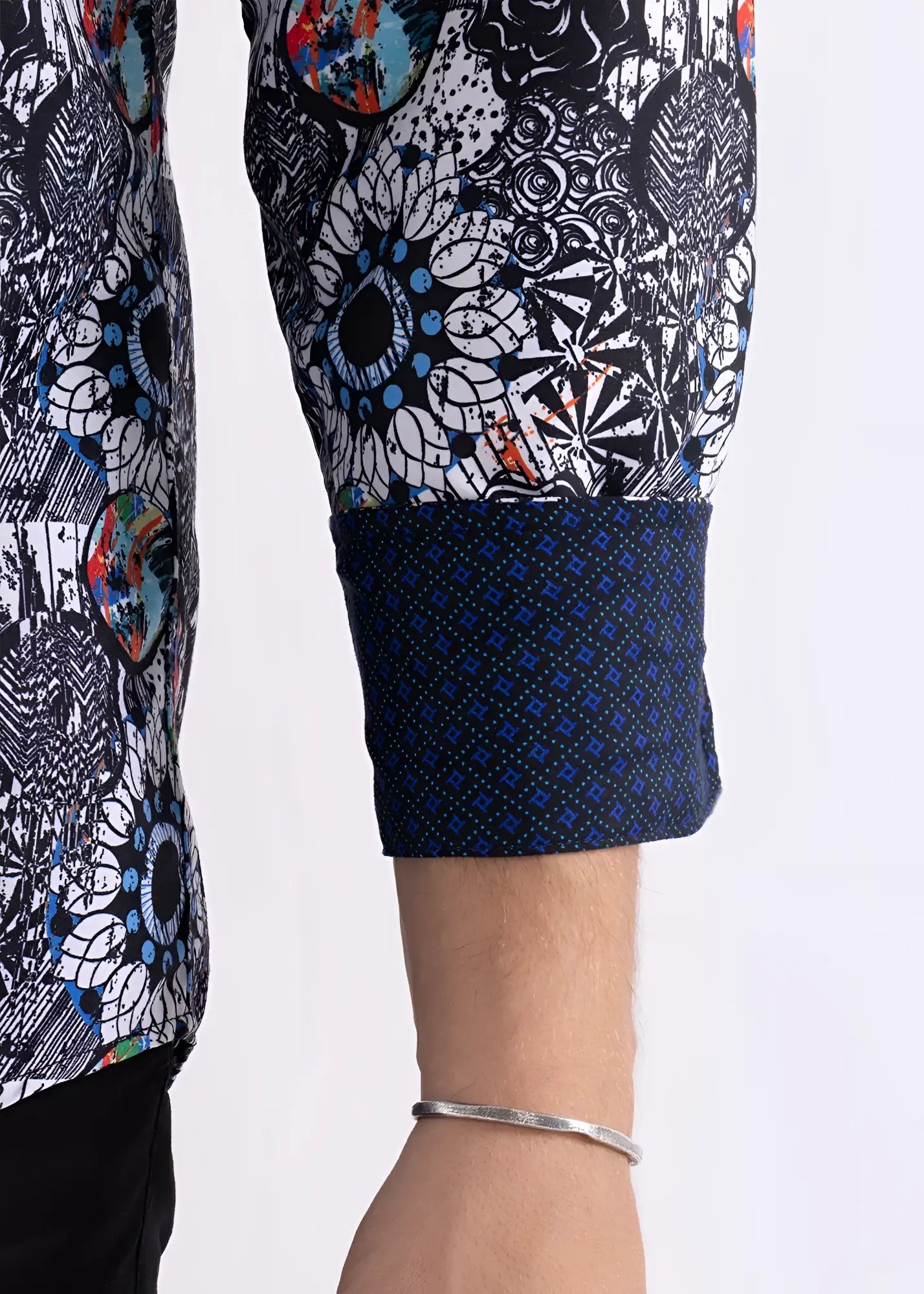 Colored shapes print long sleeve shirt with black white intricate pattern and blue orange accents on sleeve and navy cuff