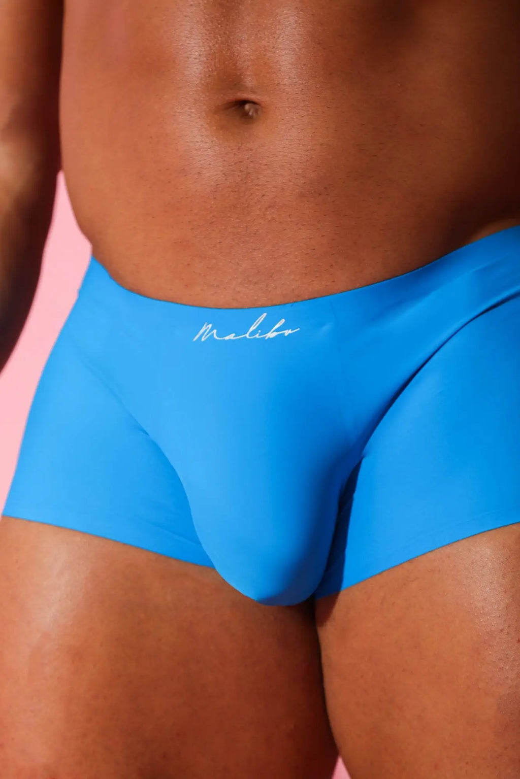 Bright blue come-over silky seamless boxer briefs with sleek form-fitting design and white cursive waistband branding
