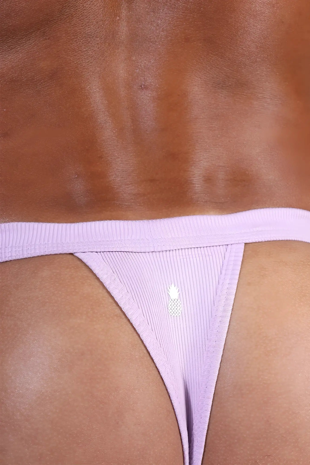 Lavender comfy everyday ribbed thong for men showing ribbed fabric and small white pineapple logo on front side