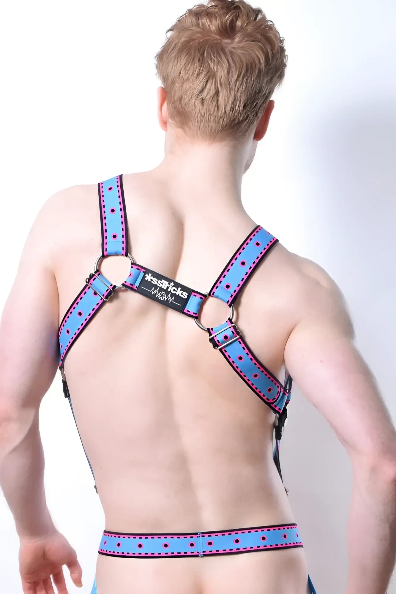 Blue polka-dotted leather harness with black metal rings and branded label from comicaze harness collection