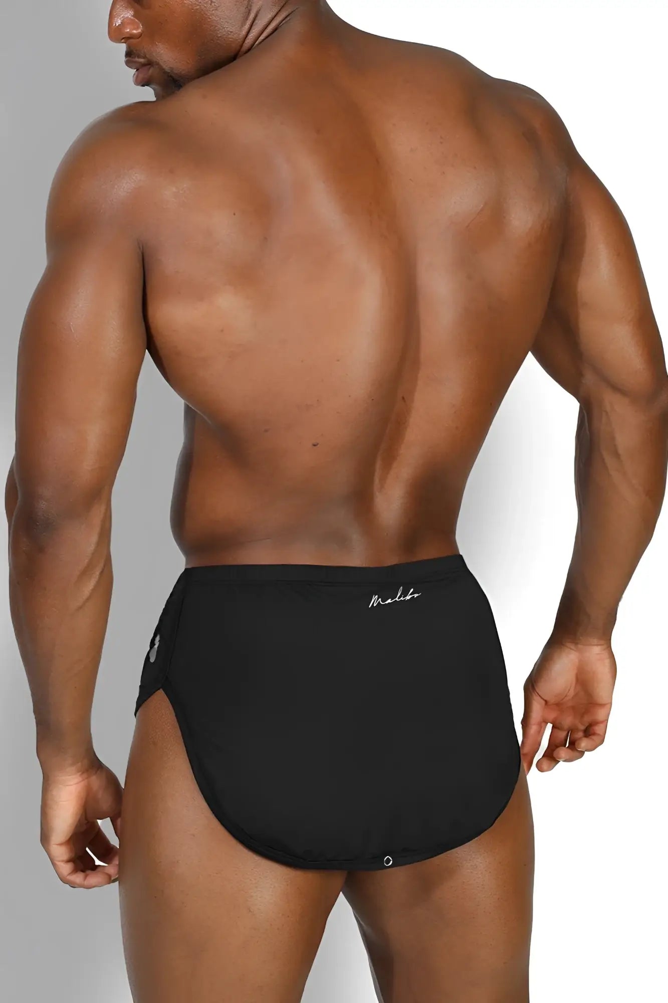 Black athletic briefs with subtle white logo on waistband part of cool-dri 2-in-1 shorts with thong lining