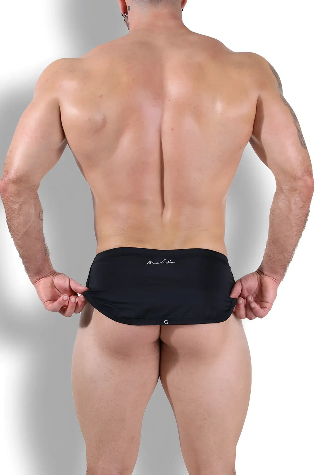 Black malibu swim trunks with cool-dri 2-in-1 fabric and subtle white logo on waistband in midnight black