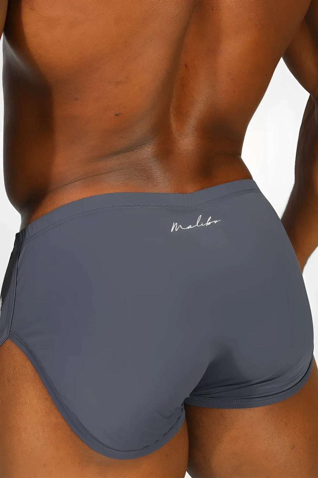 Gray malibu briefs with sleek form-fitting design and white cursive logo on waistband in cool-dri 2-in-1 space blue shorts