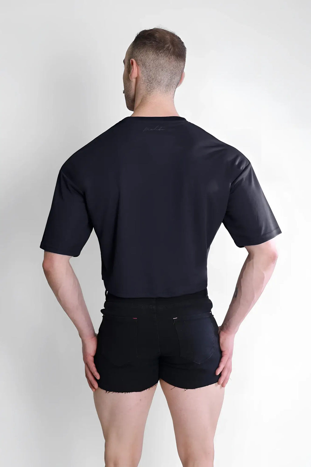 Black cool-dry oversized relaxed crop top with short sleeves and subtle textured fabric for casual wear