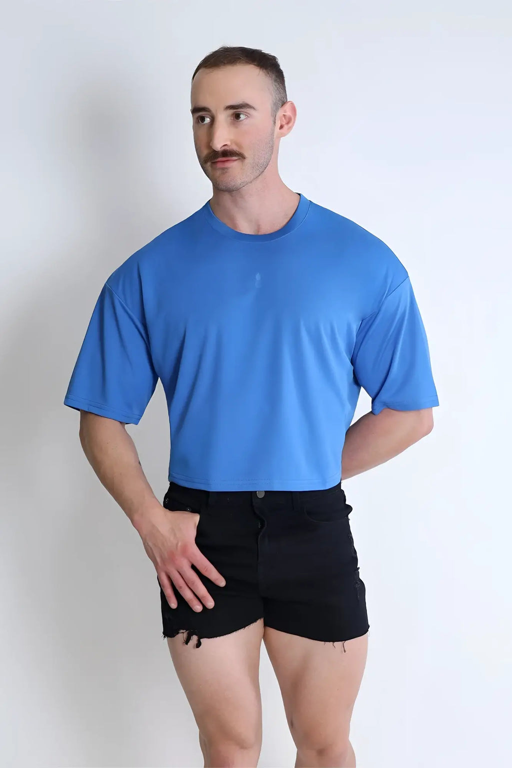 Blue cool-dry oversized relaxed crop top with short sleeves and crew neck made from moisture-wicking fabric